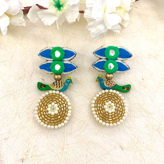 Peafowl on her Wrecking Ball Earrings