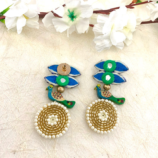 Peafowl on her Wrecking Ball Earrings